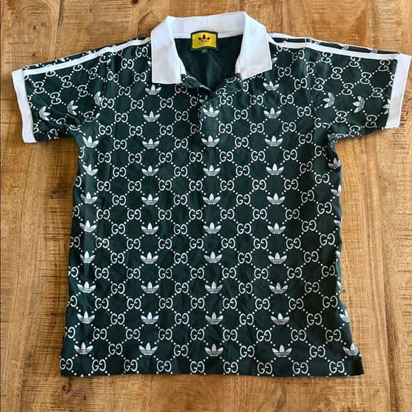 Gucci Other - Gucci Men's Polo in Green with White Logo Pattern